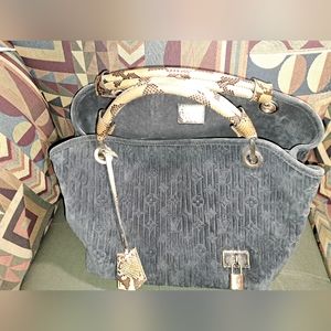 LV purse Whisper in suede material with python handles